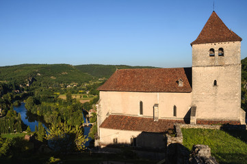 Fototapeta na wymiar Church of Saint-Cyr and Sainte-Julitte and Lot river, Saint-Cirq-Lapopie, Lot department, France