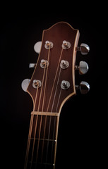 Guitar headstock on black background