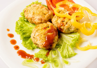 Chicken cutlets on white plate