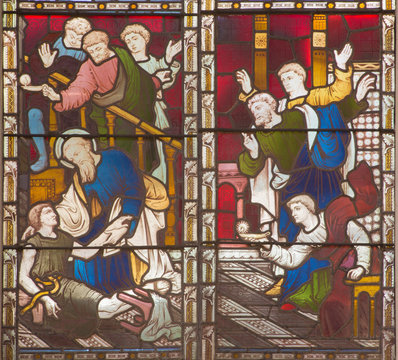 ROME, ITALY - MARCH 9. 2016: The scene St. Paul resurrection of Eutychus in Troas on the stained glass of All Saints' Anglican Church by workroom Clayton and Hall (19. cent.).
