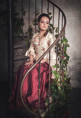 Beautiful woman in old historic medieval dress