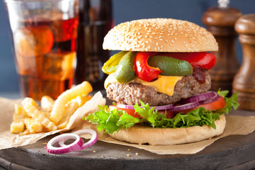 homemade cheese burger with peppers tomato onion