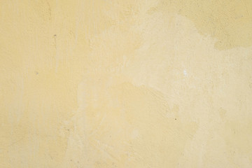 Closeup surface dirty yellow painted concrete wall textured background