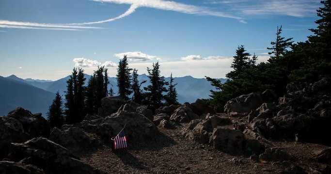 Olympic National Park, Washington, USA - camera pan over Olympic National Park with view towards Port Angeles at a sunny day with moving clouds - Timelapse with motion and zoom out 