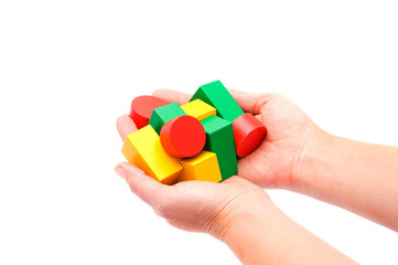 Hand with wooden blocks isolated on white background.