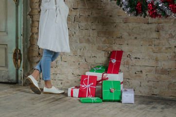 women's shoes stand next to lots of presents