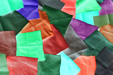 background made of small colored square pieces of fabric 