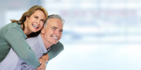 Senior couple smiling.
