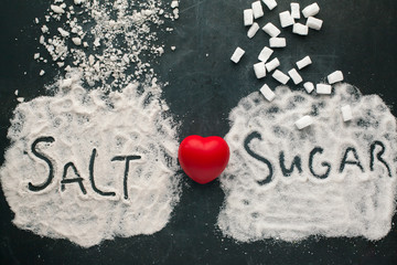 Sugar and salt brings harm to the heart, concept of healthy lifestyle without sugar and salt.