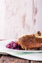 Portion of duck breast with red cabbage and crispy skin