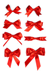 Shiny red satin ribbon on white background