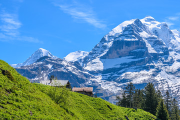 Beautiful Swiss mountain valley landscape with a single house.