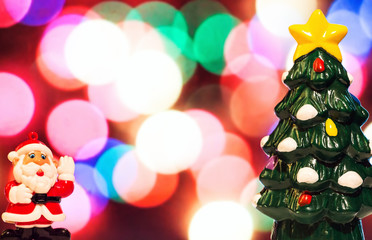 Santa Claus and Christmas tree on a beautiful blurred background