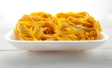 Italian tagliatelle pasta on a tray