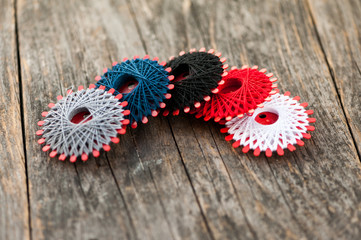 Multi-colored thread on a wooden table