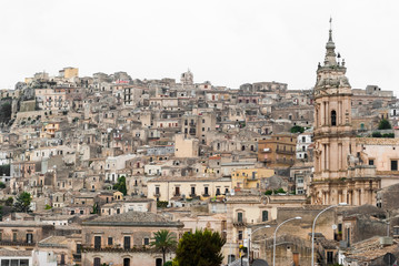 Fototapeta na wymiar Houses packed in the old town of Modica, in Sicily