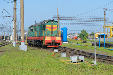 Fototapeta na wymiar locomotive at a railway station in the summer