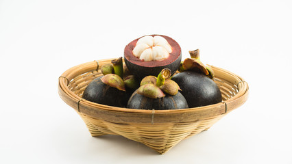 mangosteens in bamboo basket isolated on white background
