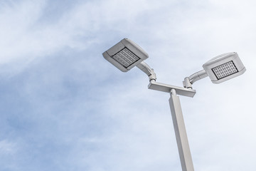 LED street lamp post with blue sky cloud.