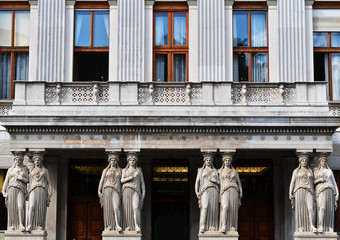 Balcony with caryatids in the Austrian Parliament Building view from Rathausplatz in Vienna