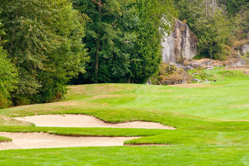 Fototapeta na wymiar Golf place with nice green and bunkers.