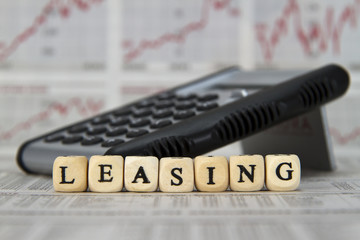 Leasing word built with letter cubes - obrazy, fototapety, plakaty
