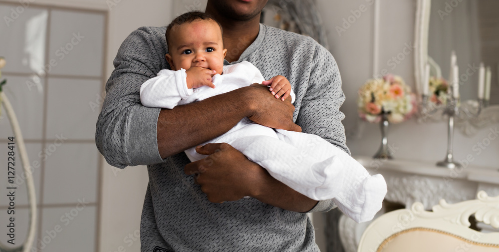 Wall mural Father Playing With Baby Son At Home