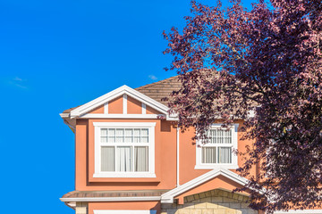The top of the house or apartment building with nice window.