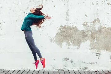 Foto op Aluminium Fitness sport girl in the street © Alena Ozerova