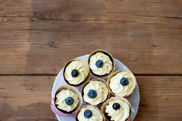 Close up, cupcakes with vanilla cream. Studio shot.