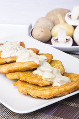 potato pancakes with mushroom sauce
