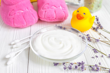 baby organic cream with lavender on shelf in bathroom