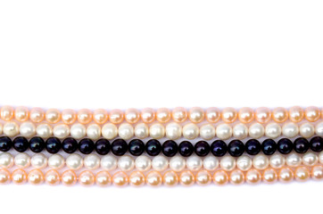 Pearls on a white background. Top view, flat lay