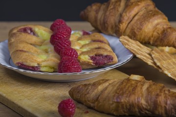 assortment of pastries with honey, raspberries and other - vintage
