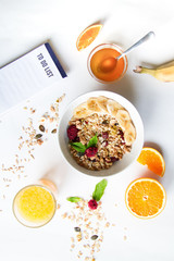 Breakfast with oatmeal and to do list on white background