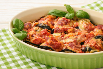 Casserole with roasted eggplants stuffed with minced meat.