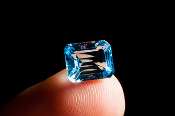Cutter demonstrates gemstone topaz