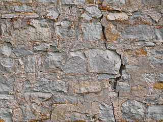 Old brick stone wall background, rural limestone stonewall texture