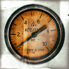 Air pressure gauge, old vintage soviet(Made in USSR), pressure gauge stylised as aged old b&w sepia toned photos. Industry background.