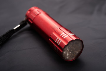 red LED torch on a black background