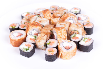 Japanese food restaurant, sushi maki gunkan roll plate or platter set. California  rolls with salmon.  isolated at white background. Top view, flat lay.