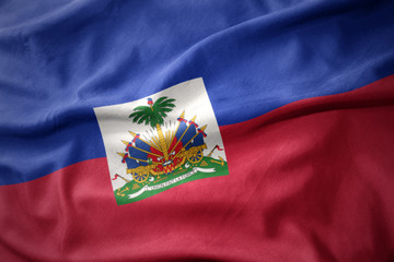 waving colorful flag of haiti. © luzitanija