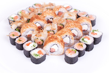 Japanese food restaurant, sushi maki gunkan roll plate or platter set. California  rolls with salmon.  isolated at white background. Top view, flat lay.