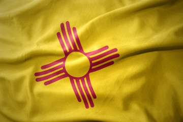 Obraz premium waving colorful flag of new mexico state.
