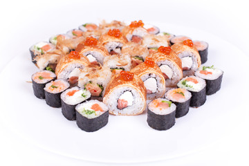Japanese food restaurant, sushi maki gunkan roll plate or platter set. California  rolls with salmon.  isolated at white background. Top view, flat lay.