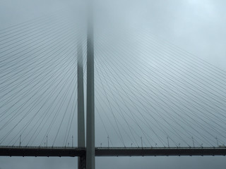 Detail of golden bridge in the fog. Vladivostok. Russia
