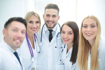 Fototapeta premium Smiling Team Of Doctors At Hospital Making Selfie