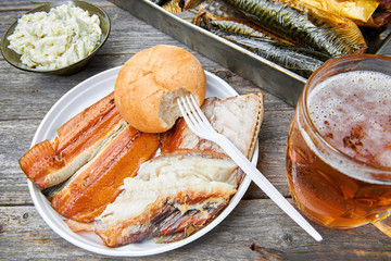 Meal consisting of smoked fish and beer