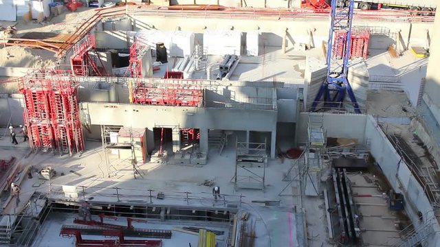 Time lapse shot of a large scale construction site as they are building the foundations to a large building