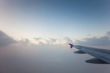Fototapeta na wymiar View from plane window, cloud sky